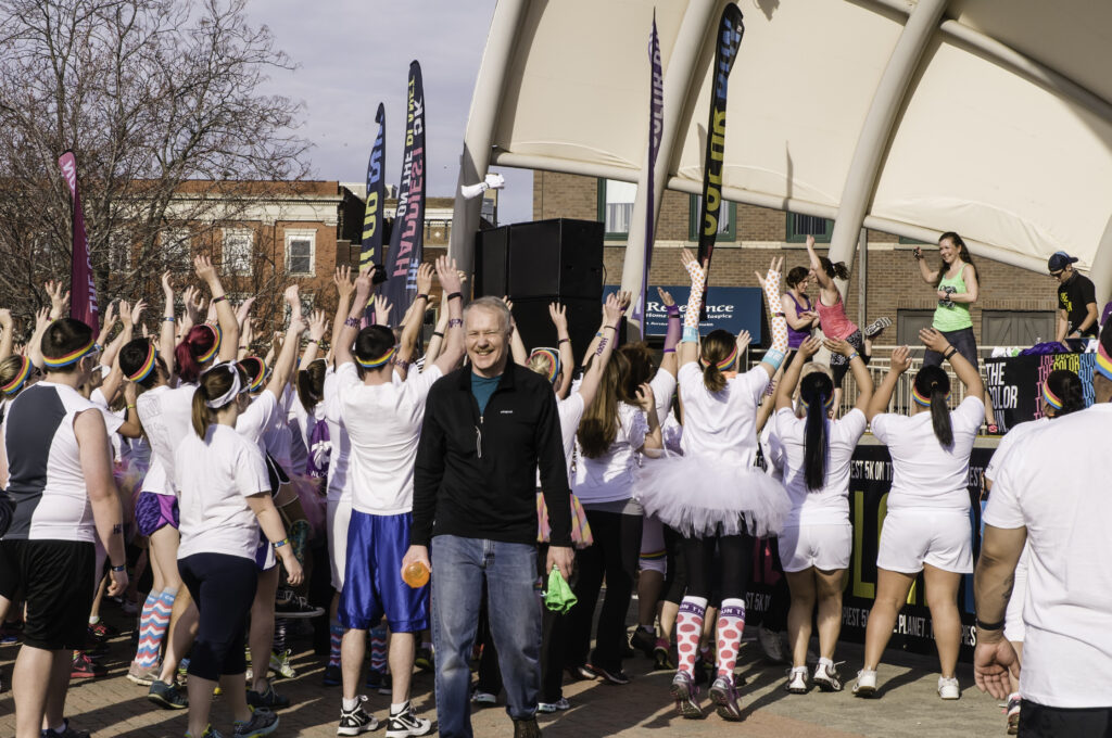 Participants Cheering At Outdoor Community Event.